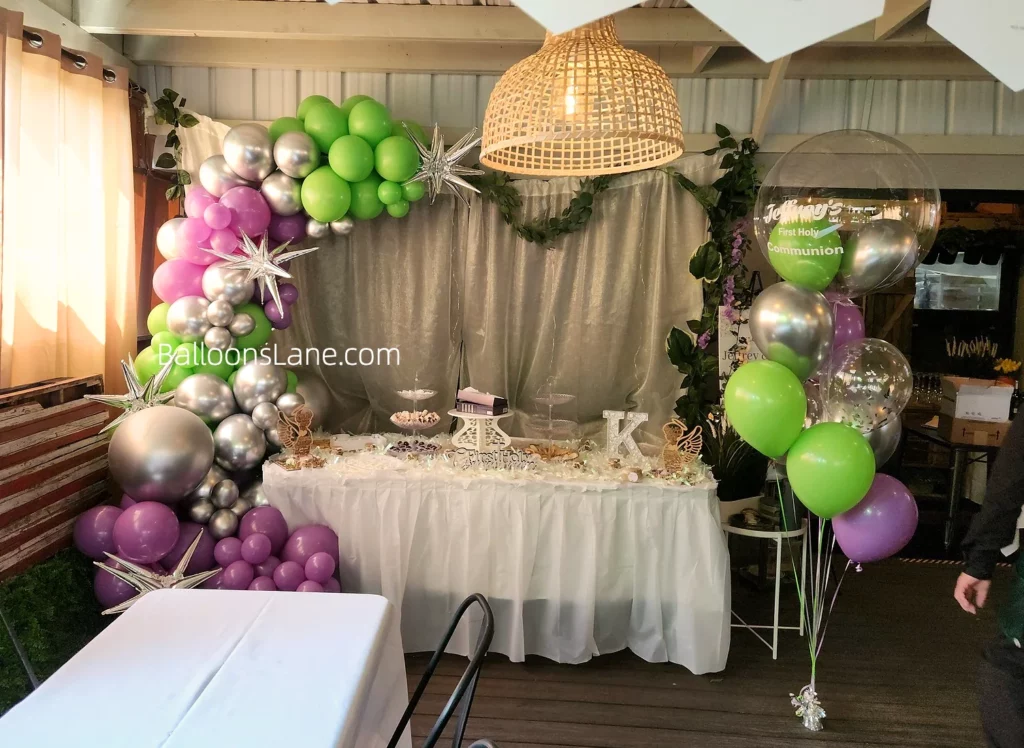 Lavender, Mint Green, and Silver Balloon Arch with Matching Balloon Column and Star Foil Balloon to Celebrate Birthday