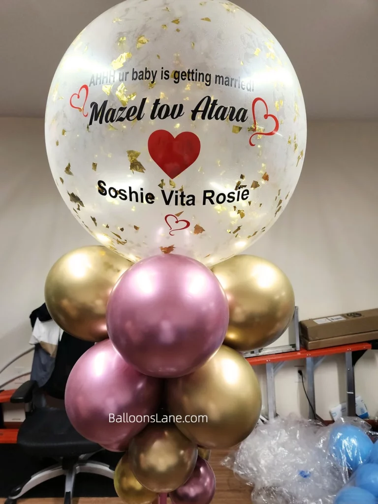 Customized engagement balloons with pink and gold chrome balloons in Brooklyn.