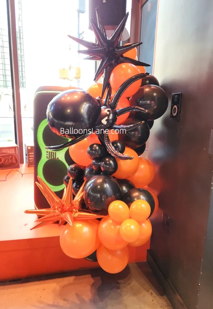 Halloween balloon theme with orange and black latex balloons, and star balloons in NJ