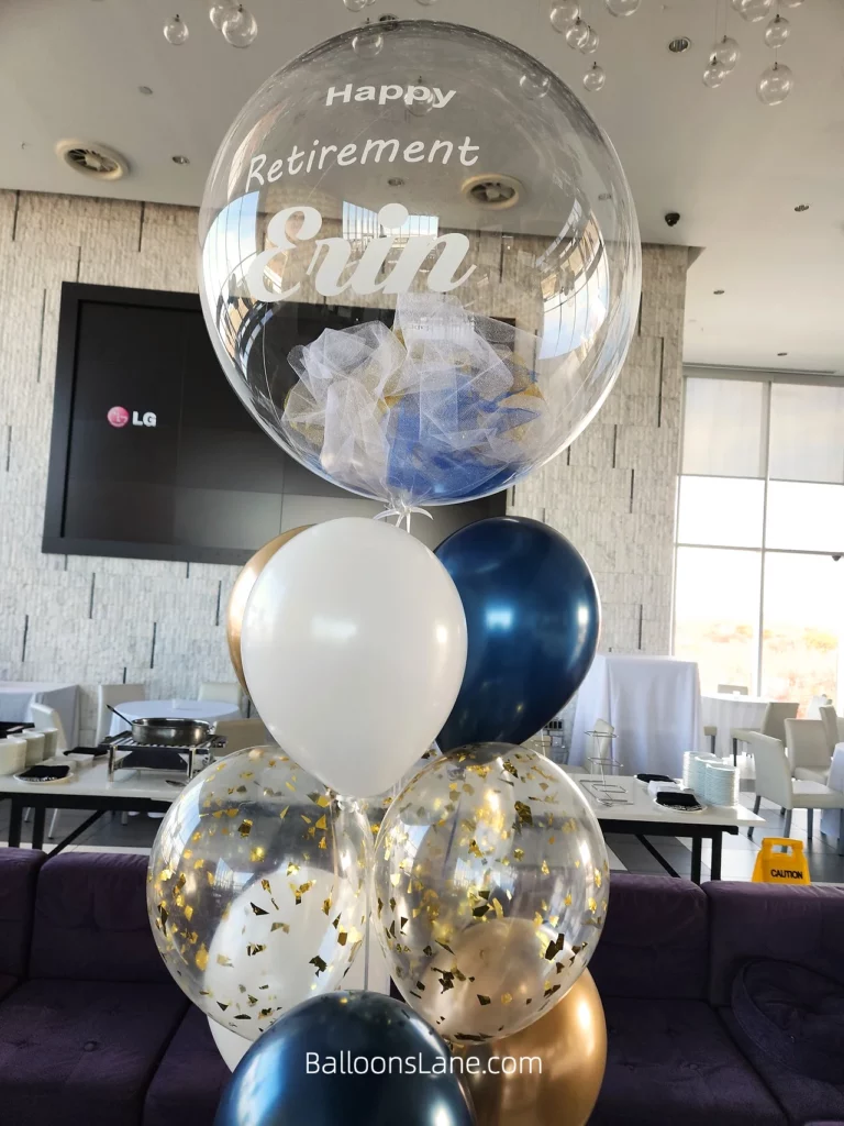 Happy Retirement Balloon Bouquet with Feather Clear Balloon, White, Blue Confetti, and Gold Balloon by BalloonsLane in Brooklyn