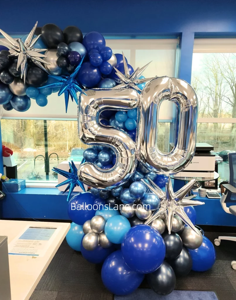 The delightful bouquet featured silver number 50 Mylar balloons surrounded by blue latex balloons and accented with a large blue star balloon and a big round blue balloon.