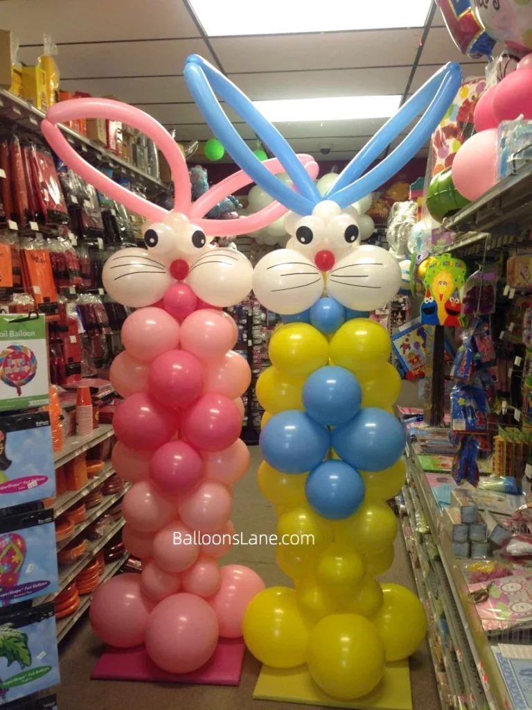 Easter-themed balloon column with pink, yellow, blue, and white balloons, accompanied by twisted balloons, in Brooklyn.