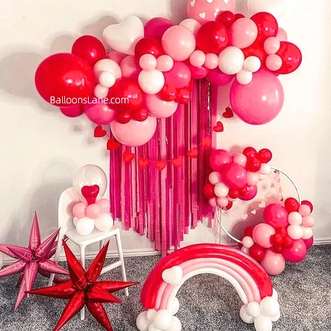 Valentine's Day Celebration in Manhattan with White, Pink, and Red Balloons, Red Heart-Shaped Balloons, Pink Star Balloons, and Purple Rainbows Backdrop