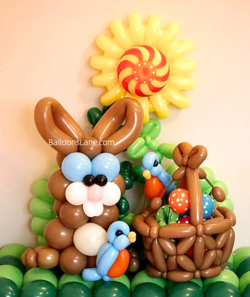 Beautiful brown bunny balloon decor with yellow and red sun theme balloon, brown twisted balloon basket, and green themed balloon base in NJ.