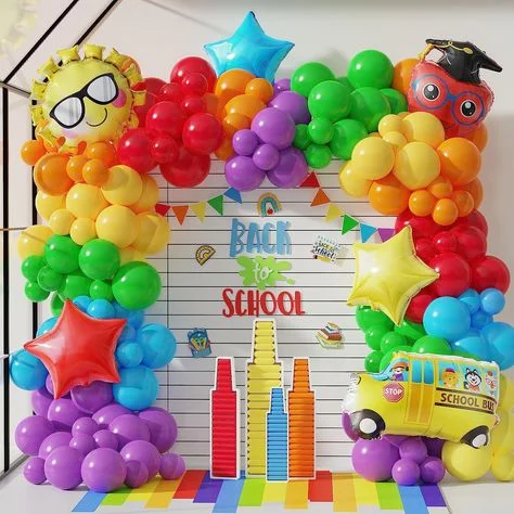 Back to School" balloon decor in purple, red, green, yellow, and blue, featuring school-themed character balloons such as a school bus and graduation cap, along with Mylar star balloons in red and yellow.