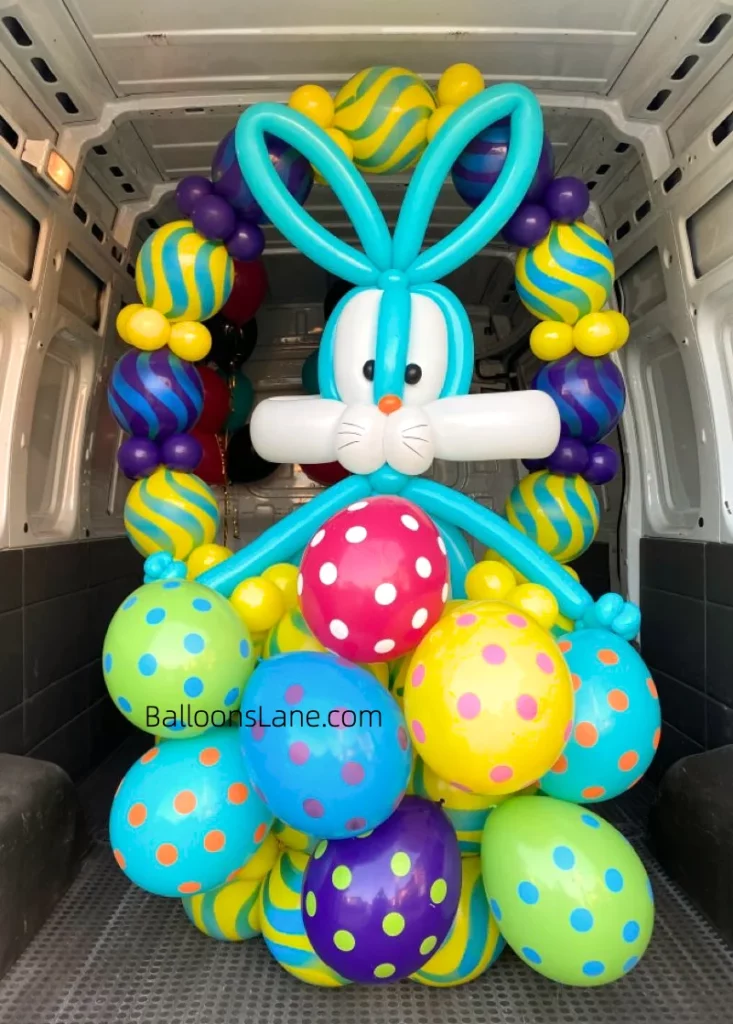 Easter balloon decorations featuring twisted balloons, latex balloons, and Mylar balloons in yellow, red, green, pink, and blue, displayed in Brooklyn.
