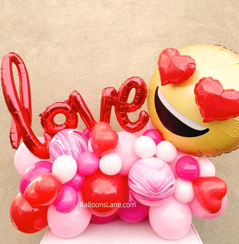 Celebrate Valentine's Day in Manhattan with Emoji Foil Balloon, Textured Pink and Red Balloons, and Love Letter Balloons