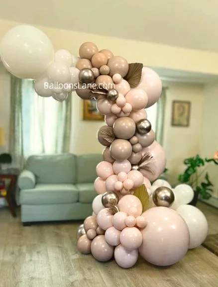 Half arch of blush, ivory silk, and pearl ivory multiple balloons, perfect for engagement, birthday, or corporate events in NYC.
