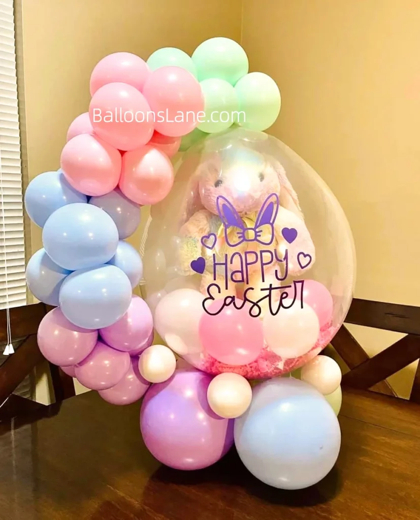 A festive Easter customized balloon featuring a clear pocket, surrounded by pink, blue, green, and purple balloons of various sizes, in Brooklyn.