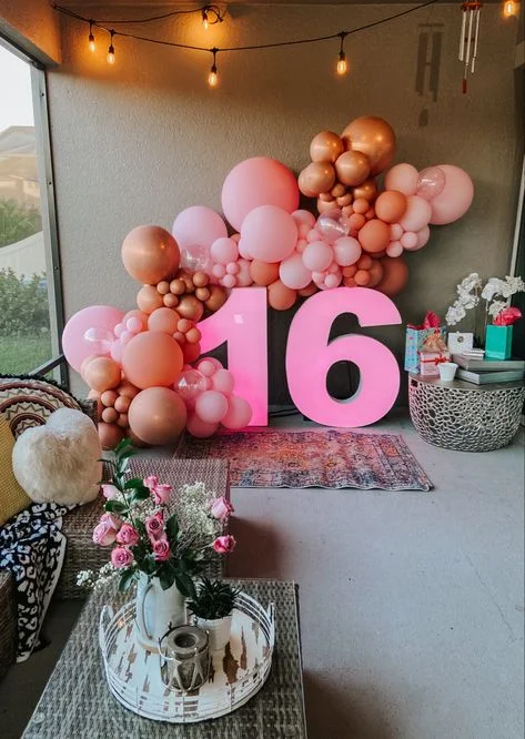 Sweet 16 celebrations with balloon backdrop in all shades of pink in NYC
