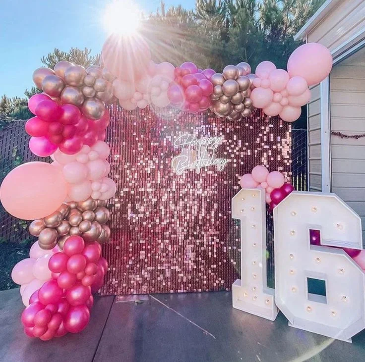 Sweet 16 celebrations with balloon backdrop in all shades of pink in NYC