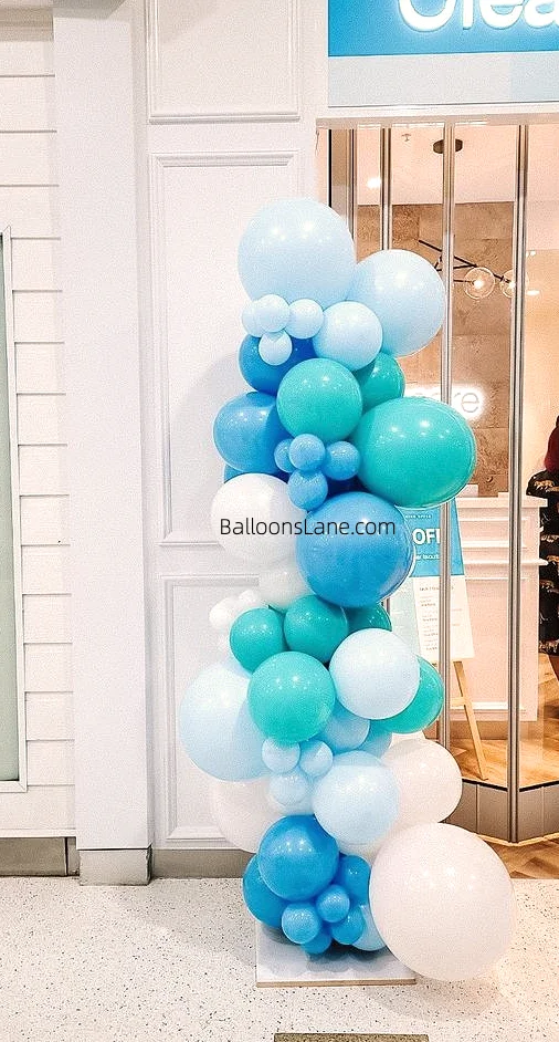 A collection of Powder Blue, Baby Blue, and Turquoise balloons, ideal for baby shower decorations for a boy.