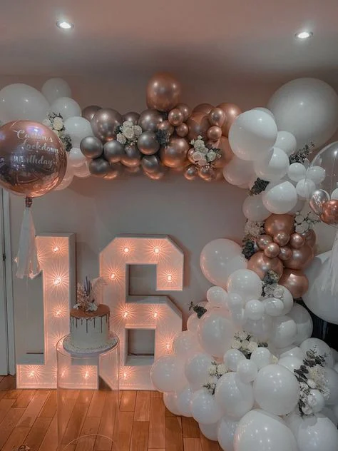 Assortment of rose gold, white, and silver balloons in multiple sizes, perfect for an event in Brooklyn.
