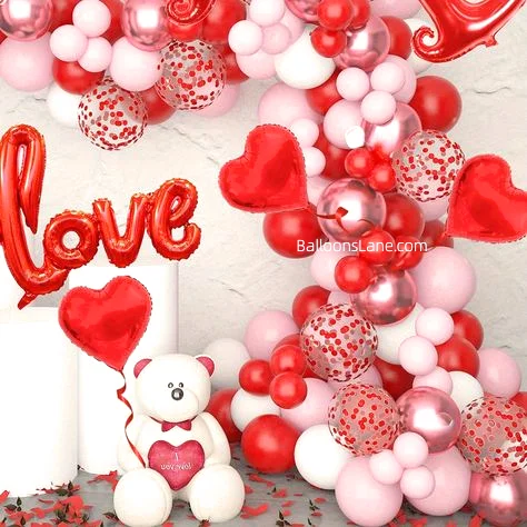Love Letter Balloons Backdrop with Red Heart Shape Foil Balloon, Red Confetti, Pink, and Red Latex Balloons in Brooklyn for Valentine's Day Celebration