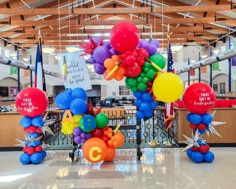 Multi-colored balloons back to school balloon columns and clusters of red, blue, orange, yellow , green , purple balloon in NYC