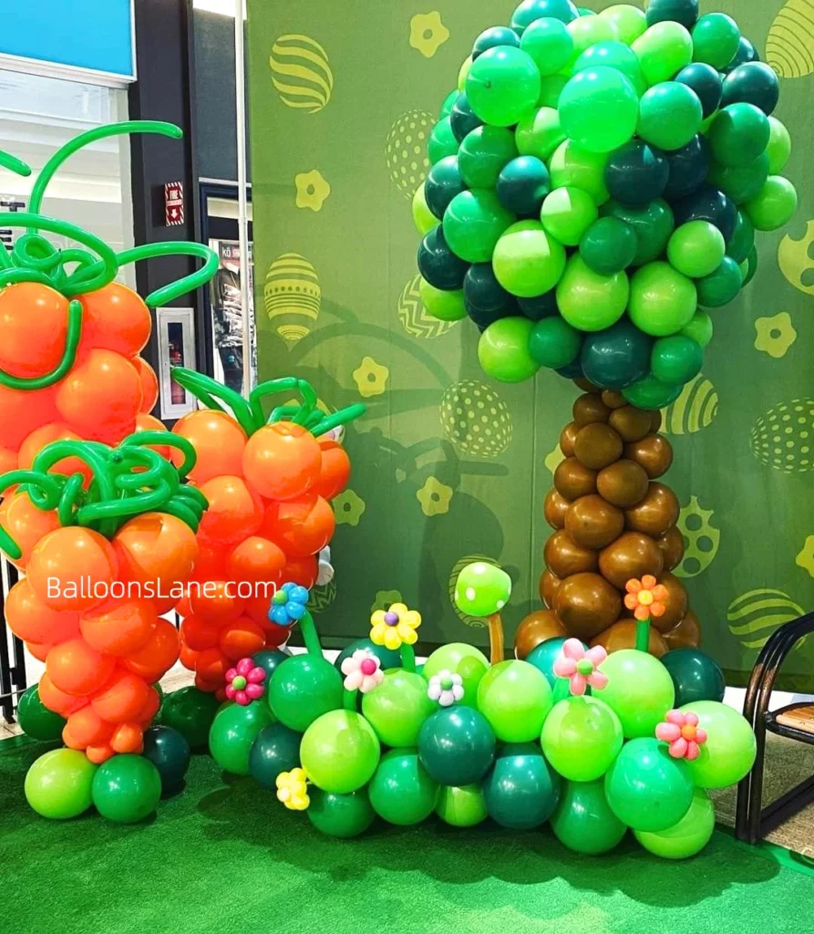 Easter-themed decor featuring green and brown tree balloons, red and green balloons arranged as garland, and pink, yellow, and purple balloon flowers, set in NJ.