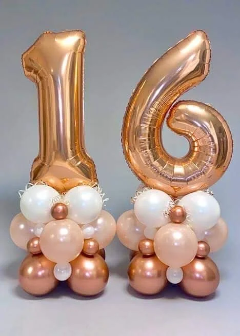 Sweet 16 balloons bouquets with rose gold number 1 & 6 balloons, accompanied by white and rose gold balloons in Manhattan.