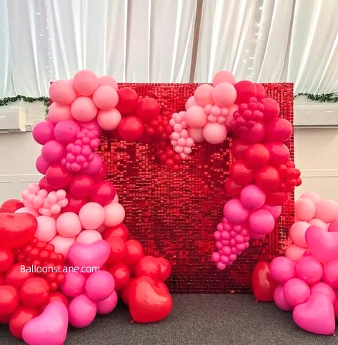 Valentine's Day Celebration in NJ with Red and Pink Balloon Backdrop and Red Heart-Shaped Balloon