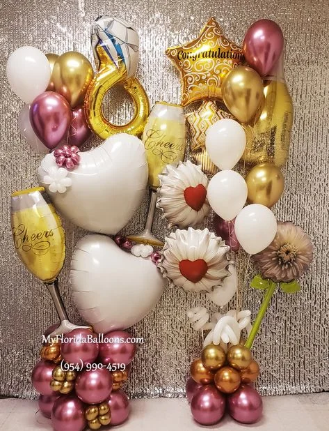 Engagement Theme Decor with Flower, Ring, Wine Glass, Wine Bottle, and Star Balloon Bunch in Pink, Gold, and White to Create an Unforgettable Event in NYC