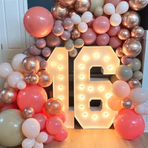 A Sweet 16 multi-color balloon garland in pink, purple, rose gold, and white, ready to celebrate in New Jersey.