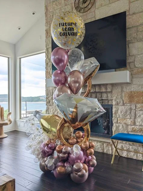 Engagement balloons bouquet featuring rose gold, confetti rings, and wine bottle customized confetti balloons in New York.