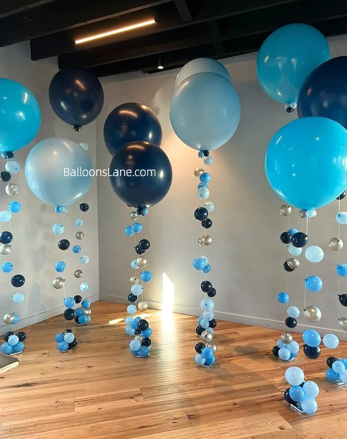 Tropical Teal, Sapphire Blue, and Caribbean Blue balloons hanging.