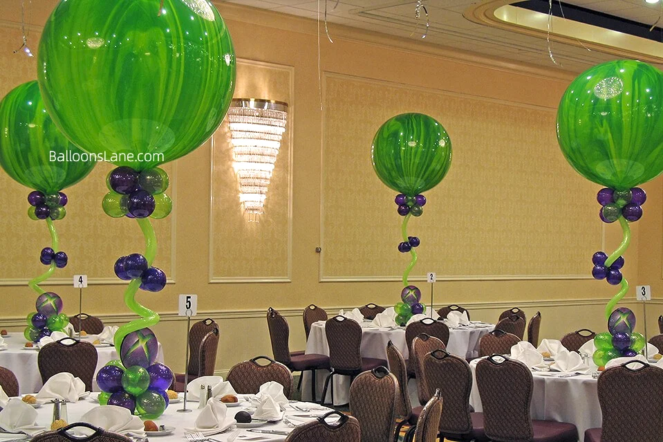 Green textured Balloon with lavander and green balloon and twisted balloons as a center piece in new York City