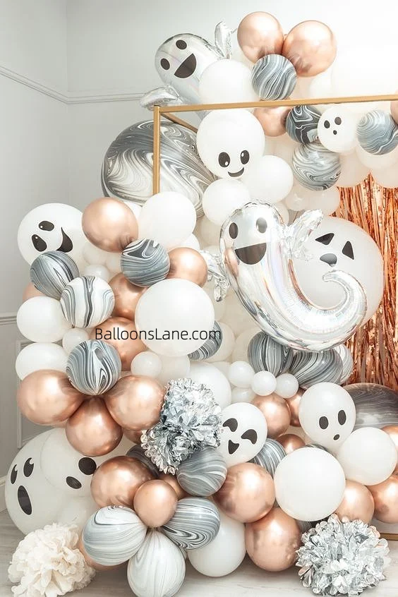 Halloween-themed horror balloon arrangement with zebra pattern and chrome pink balloons