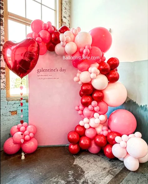 Celebrate Love on Valentine's Day in New Jersey with Pink, White, and Red Heart-Shaped Balloons Along with a Multi-Size Balloon Garland