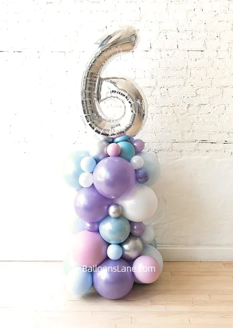 Number 6 Mylar balloons surrounded by lavender, pink, silver, and light blue balloons to celebrate in style.