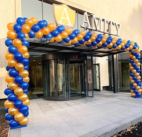 The orange and blue latex balloon arch, perfect for opening day, graduation, and welcome back to school events.