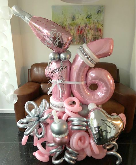 Sweet 16 Celebration with pink foil 1 & 6 number balloons, silver twisted balloons, silver heart-shaped balloons, and silver foil balloons in NY.