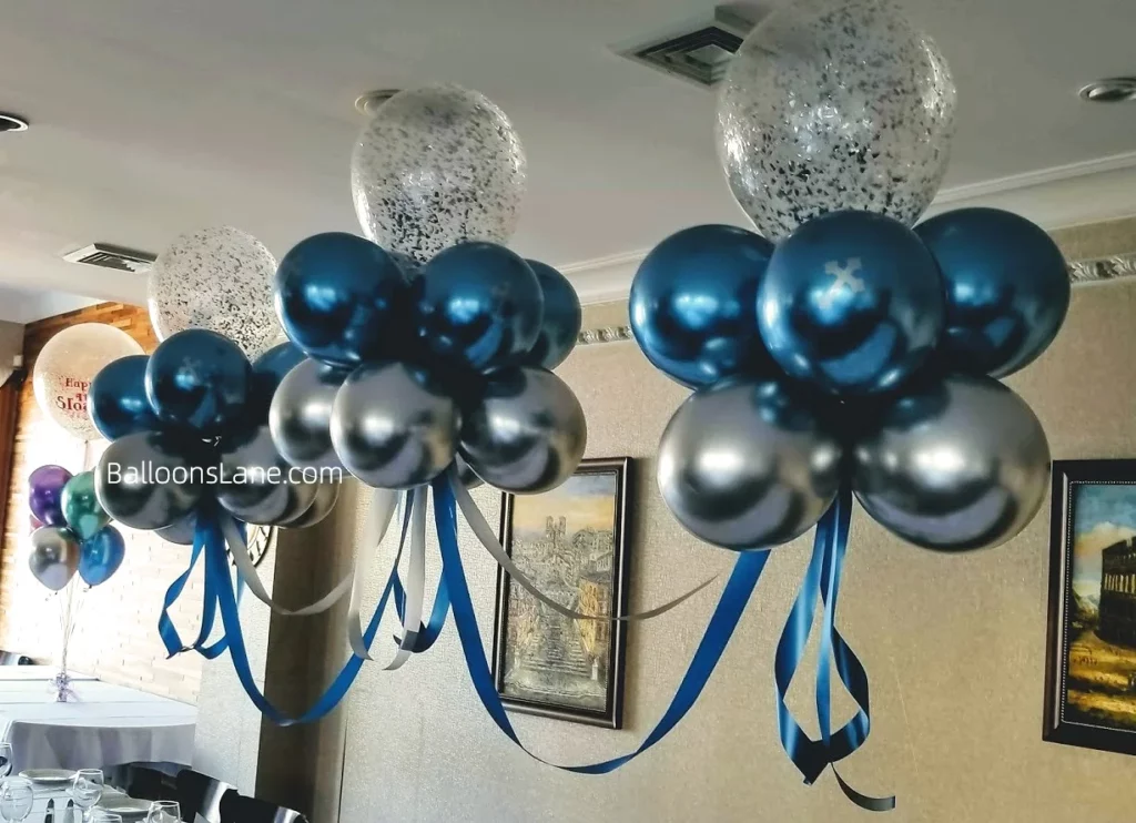 Baby christening balloons featuring a floating arch in chrome silver and blue in Staten Island.