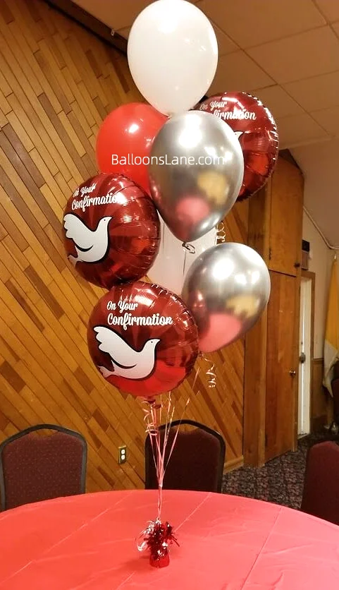 Customized balloons bouquet for a confirmation party, featuring red, white, and silver balloons.