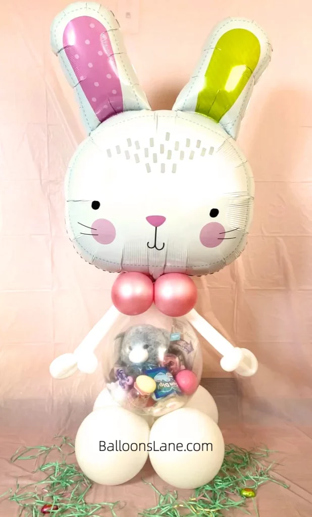 Beautiful bunny balloon with a clear balloon pocket filled with candy, located in NJ.