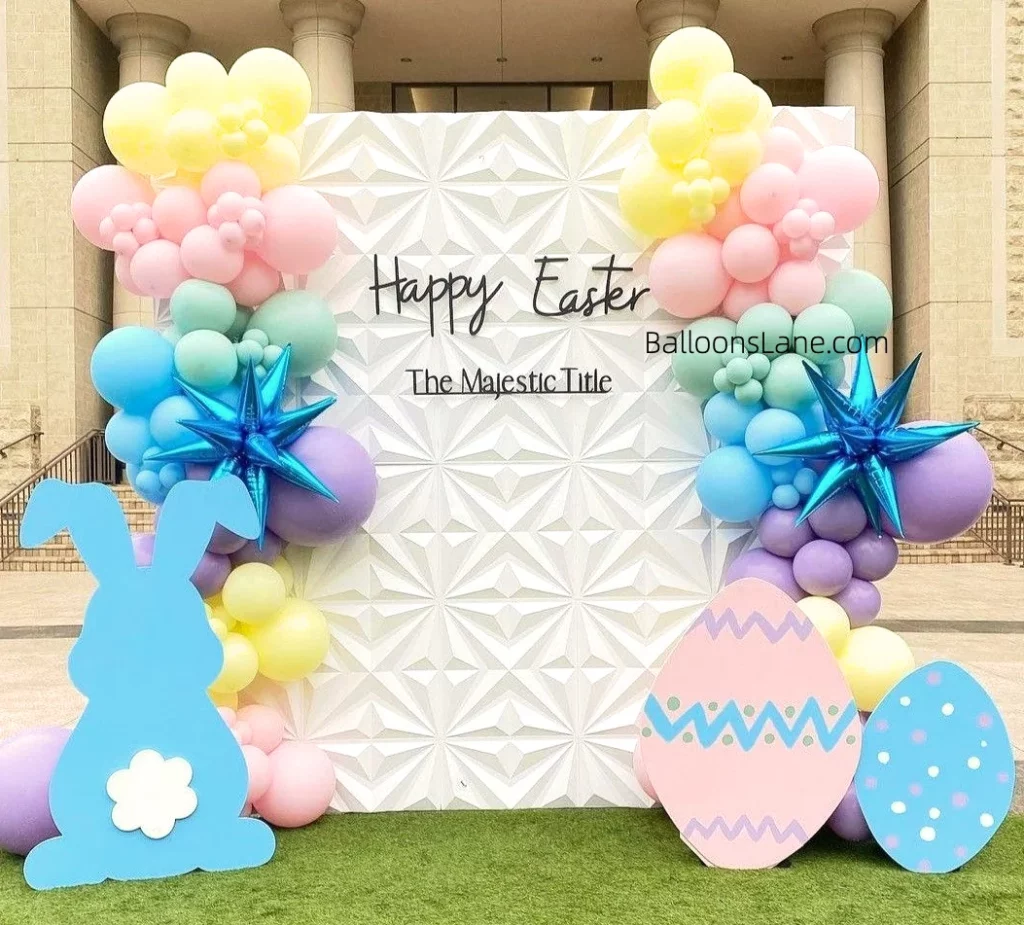 The beautiful Easter backdrop in NYC featured an array of balloons in pink, yellow, green, purple and blue, highlighted by a prominent blue star balloon.