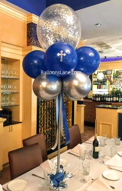 Dark blue communion balloons with silver confetti as a centerpiece to celebrate communion in NYC