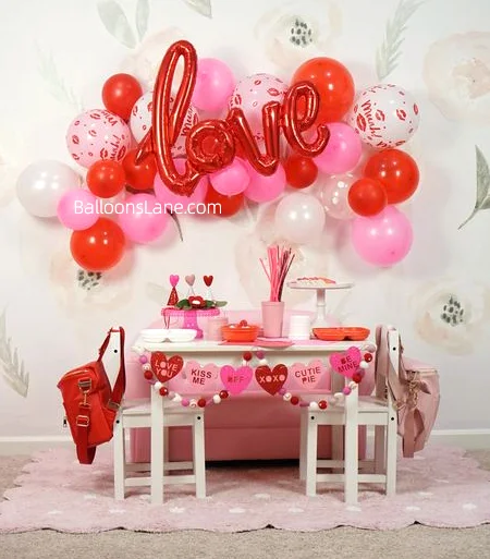 Red and pink printed balloons with red letter balloons as backdrop to celebrate Valentine's Day in NJ