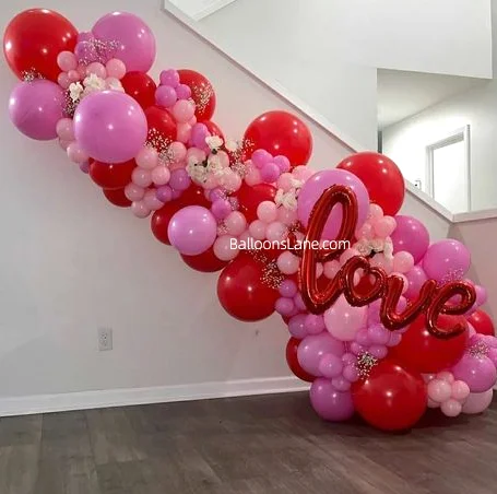 Red and pink multi-size balloons with red letter balloons to celebrate Valentine's Day in NJ