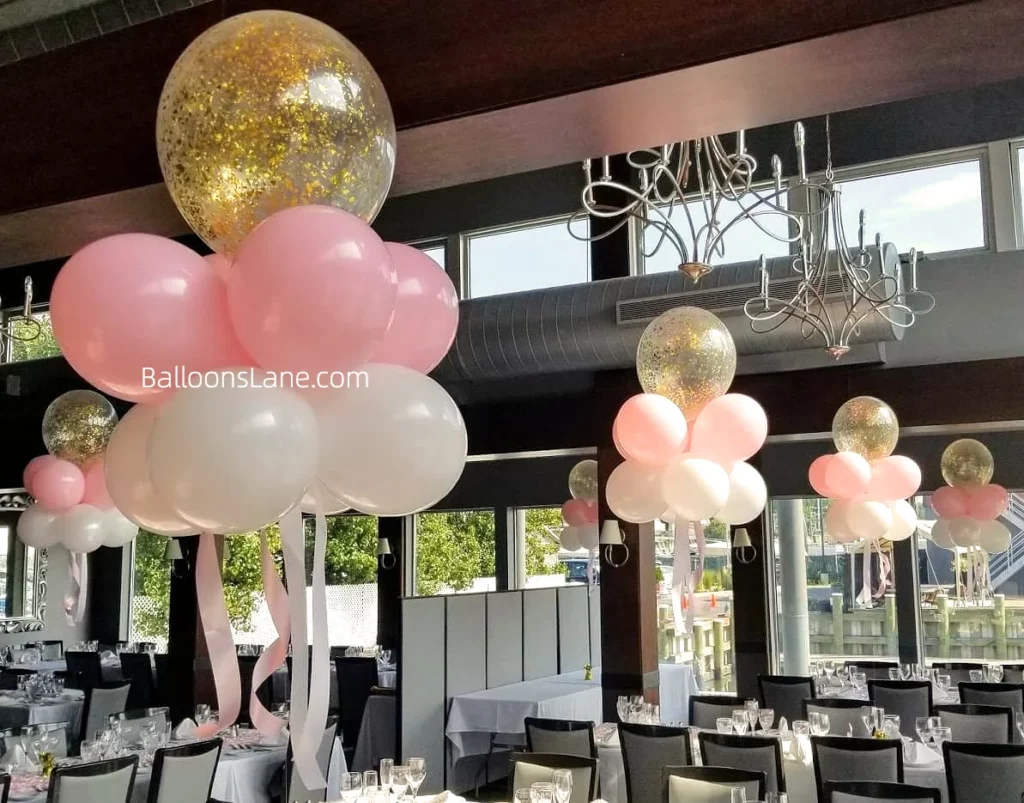 Floating baby pink balloons and pink confetti balloons to celebrate baptism in Manhattan.