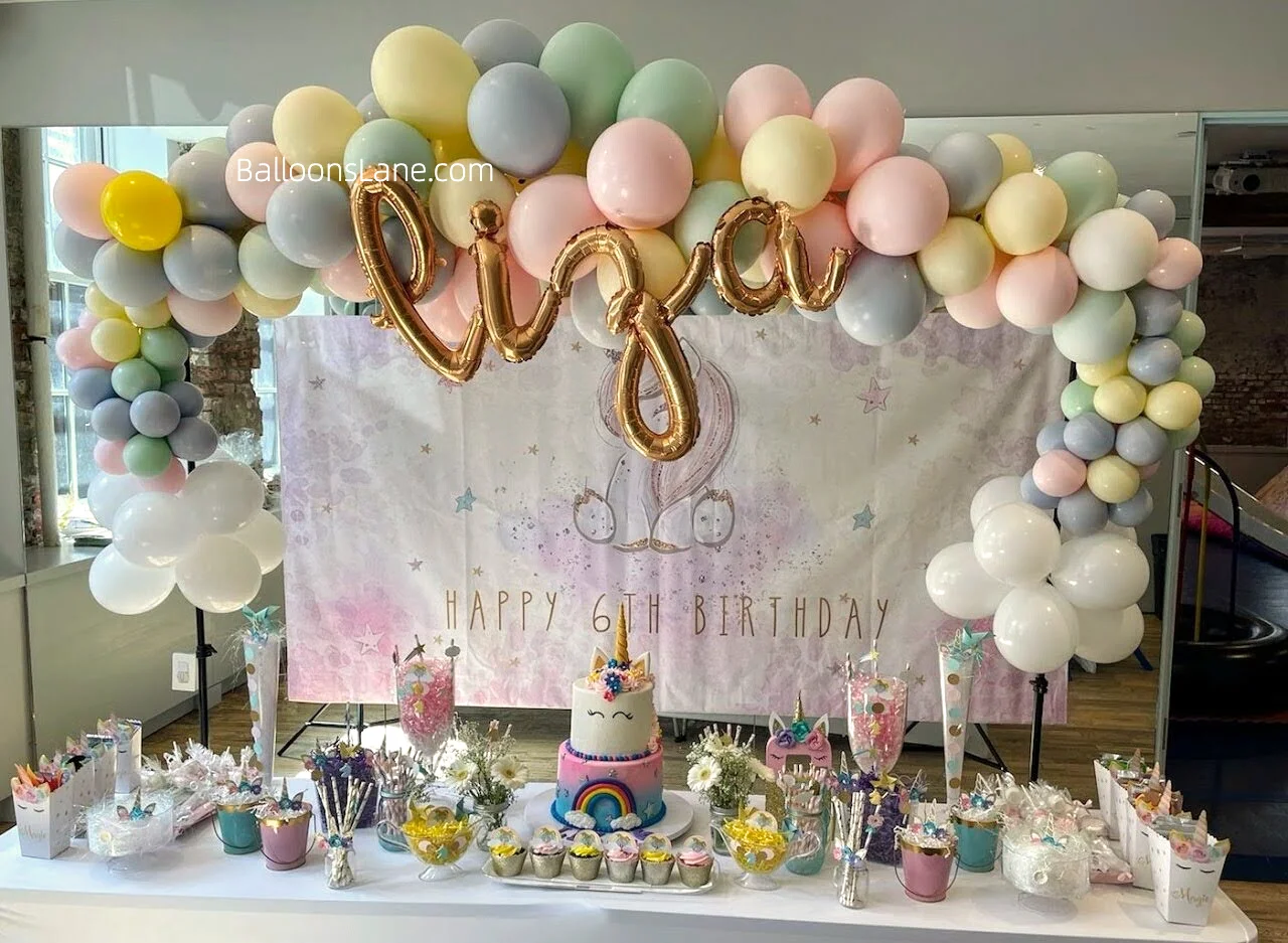 Pastel Balloon Arch and Gold Letter Balloon Backdrop for Birthday Party in NYC