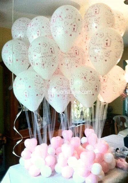 A bouquet of pink customized communion balloons on Balloons Lane in NJ.